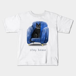 Cartoon black cat in a blue armchair and the inscription "Stay home". Kids T-Shirt